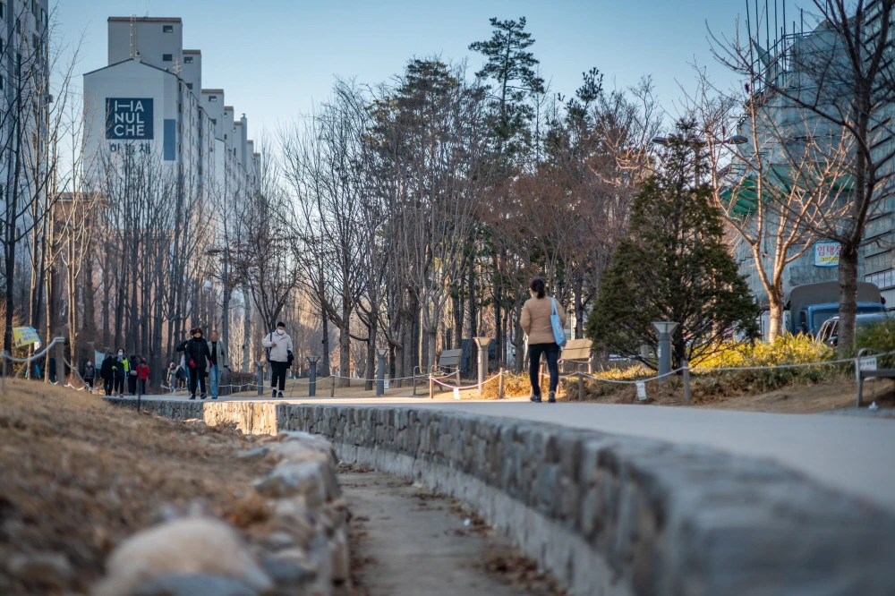 People walking the linear Gyeongui Line Forest Park through Yeonnam-dong