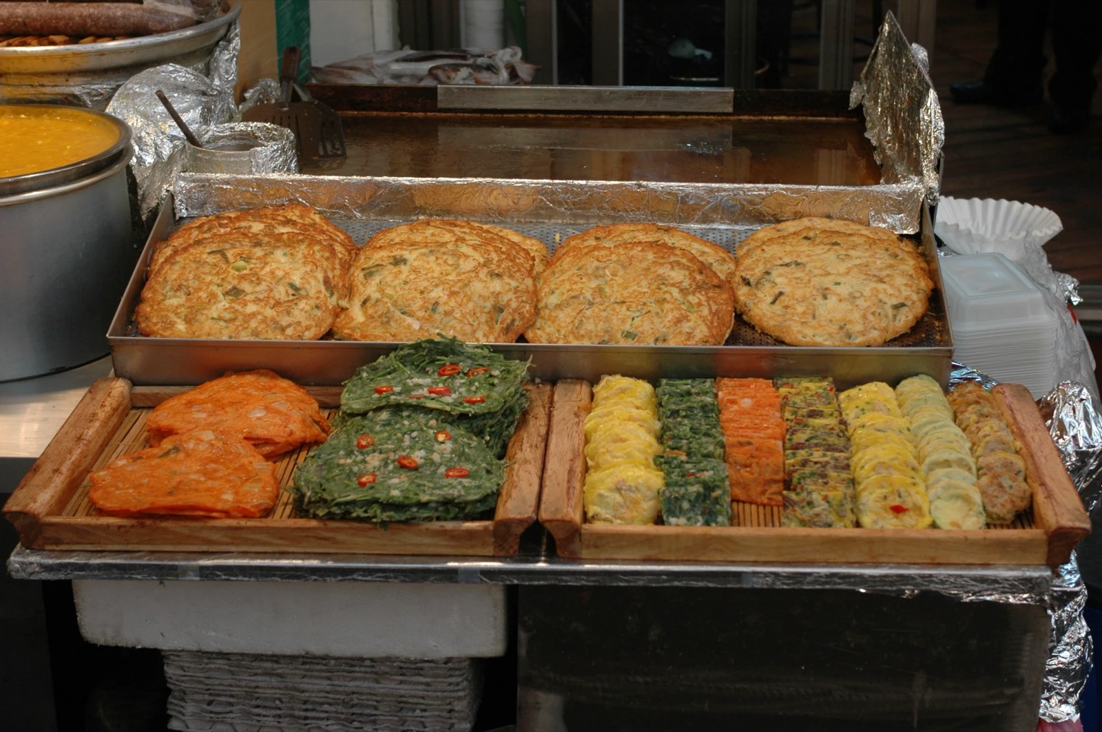 Jeon and other pan-fried foods at a Gwangjang Market stall in Seoul