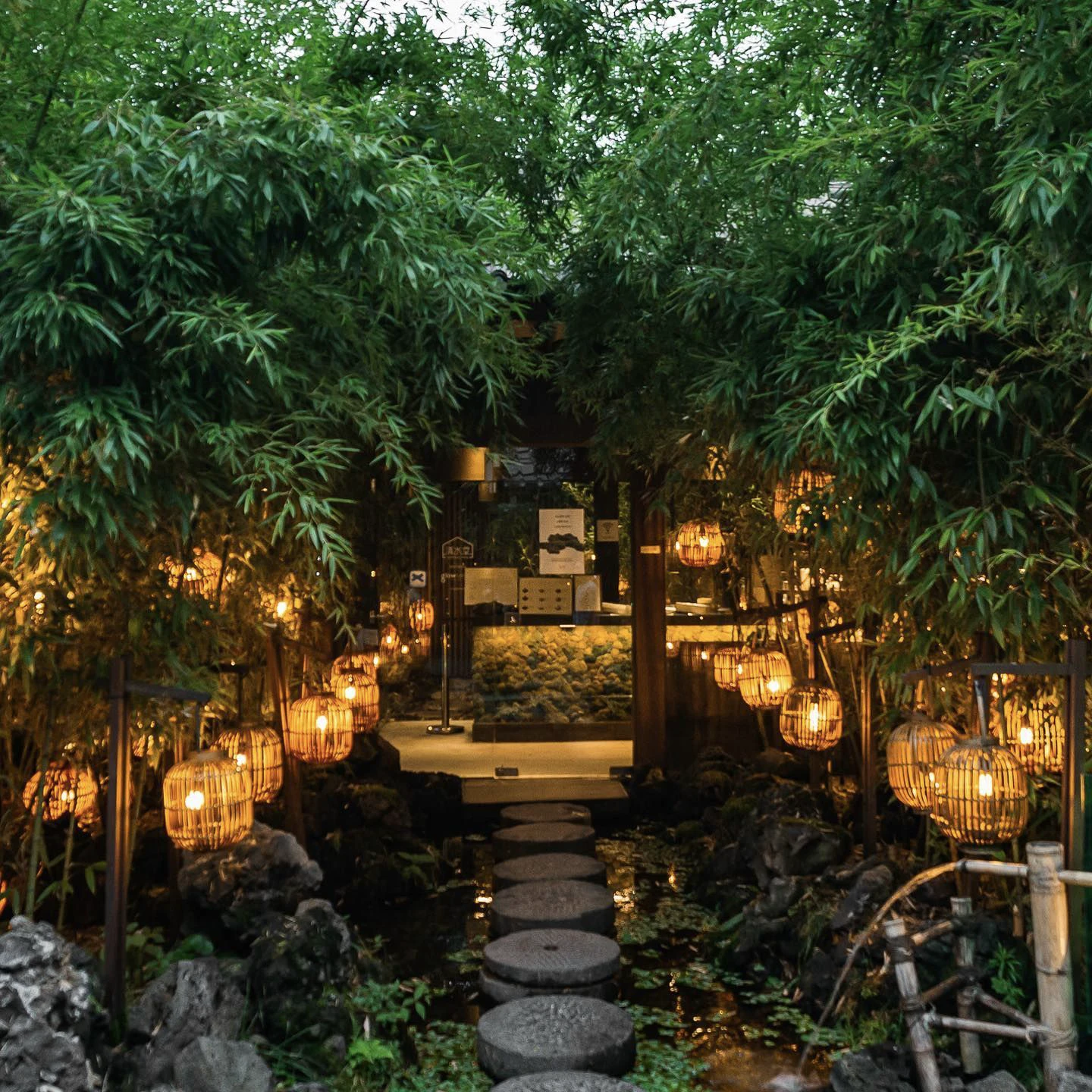 Lantern-lit bamboo garden and stepping stones at Cheongsudang Bakery in Ikseondong