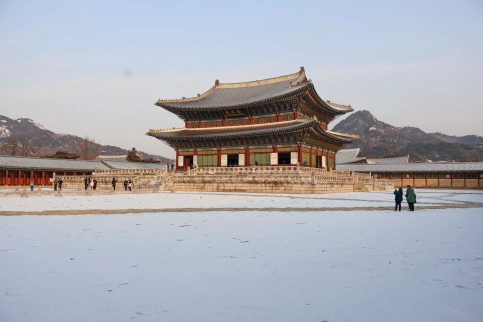 Snow-covered courtyard and Geunjeongjeon Hall at Gyeongbokgung Palace in winter