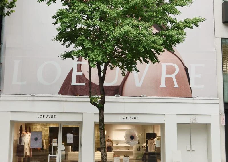 White LOEUVRE Hannam flagship storefront behind a street tree