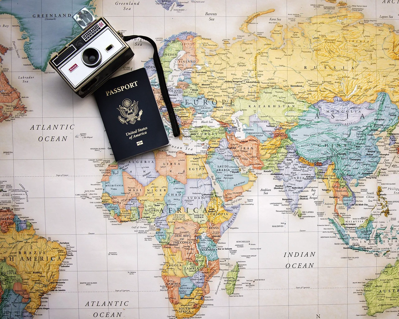 Passport placed on a world map to represent nationality-based entry rules