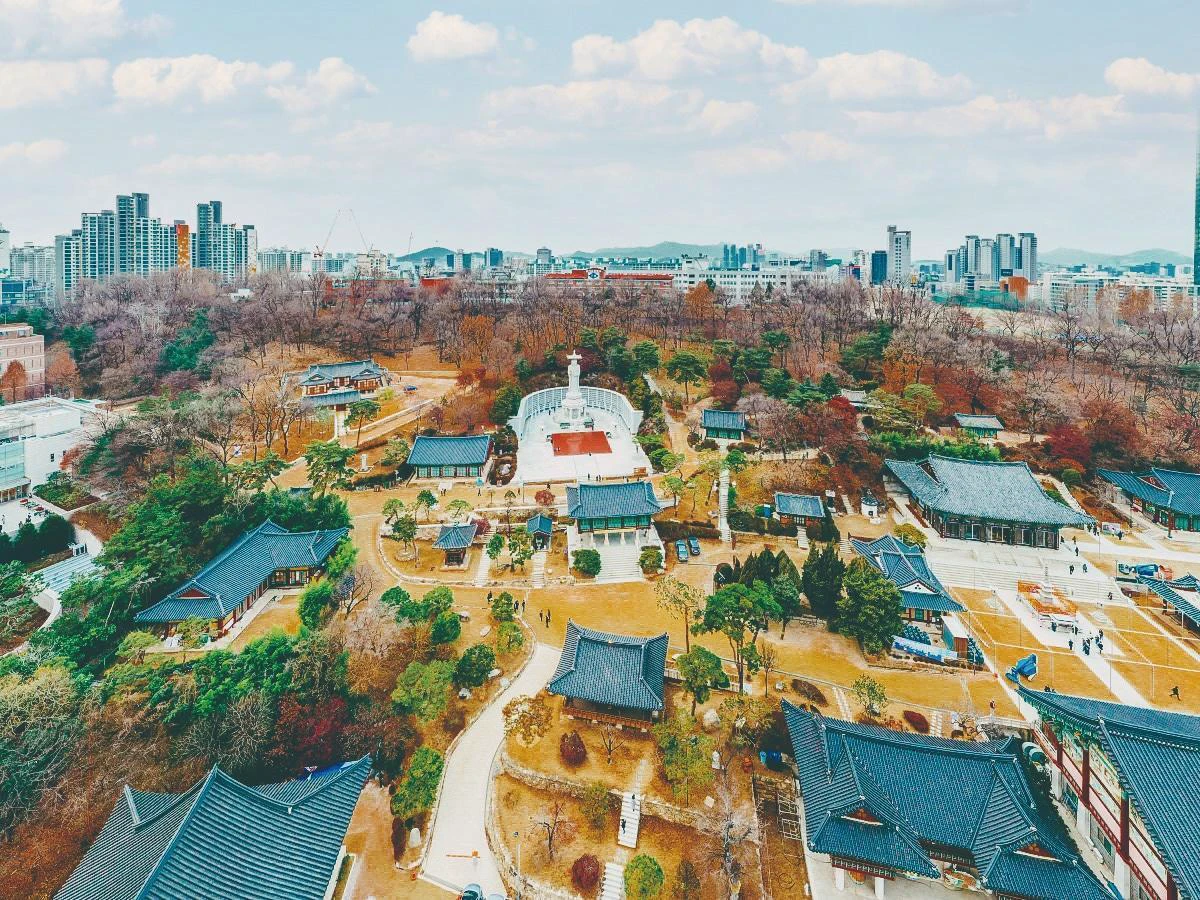 Bongeunsa temple roofs and courtyards surrounded by the Gangnam skyline
