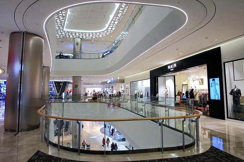 Multiple shopping levels and curved balconies inside Lotte World Mall