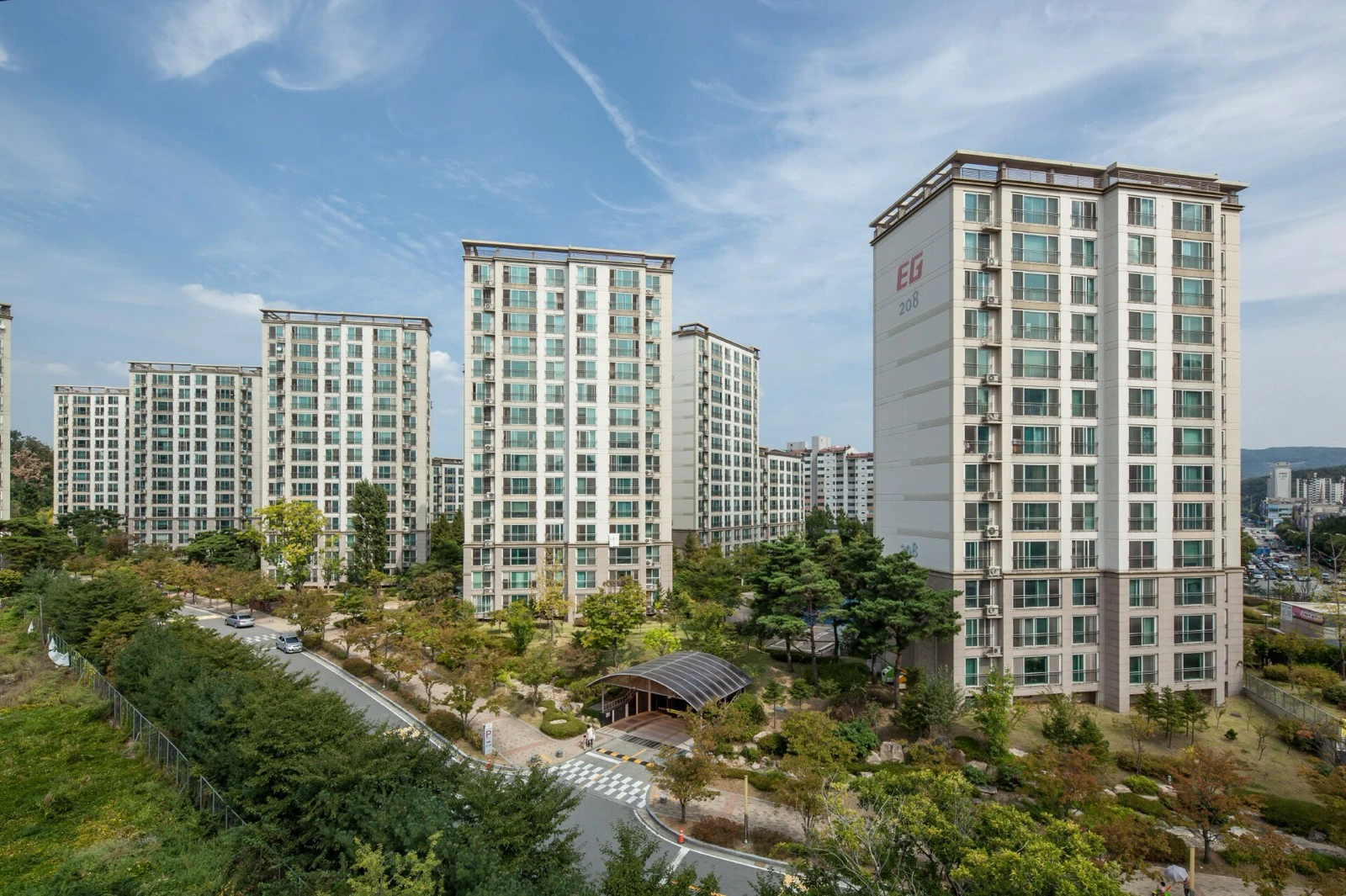A modern Korean apartment complex with several high-rise residential towers