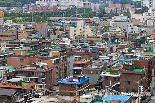 Dense neighborhood of low-rise brick and concrete villa buildings in Hwagok-dong, Seoul