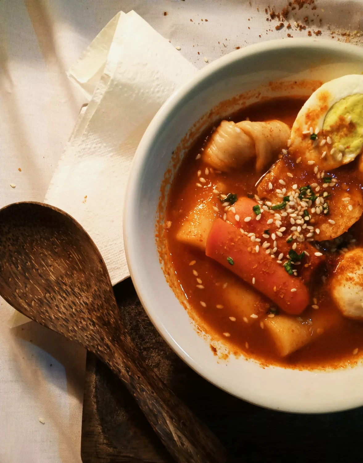 Red tteokbokki with rice cakes, fish cake, sesame and egg