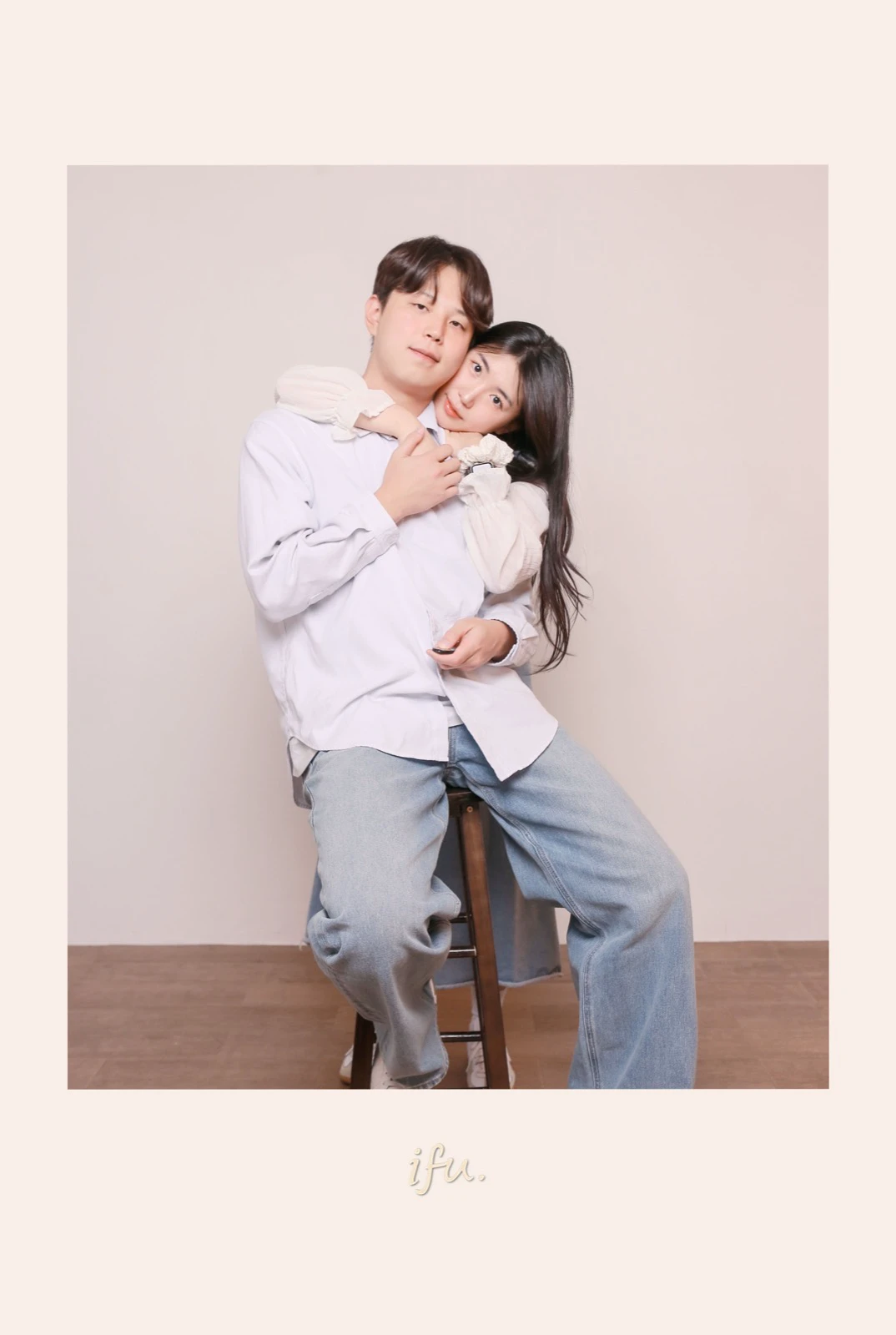 Couple posing together in a softly lit Seoul self-photo studio portrait