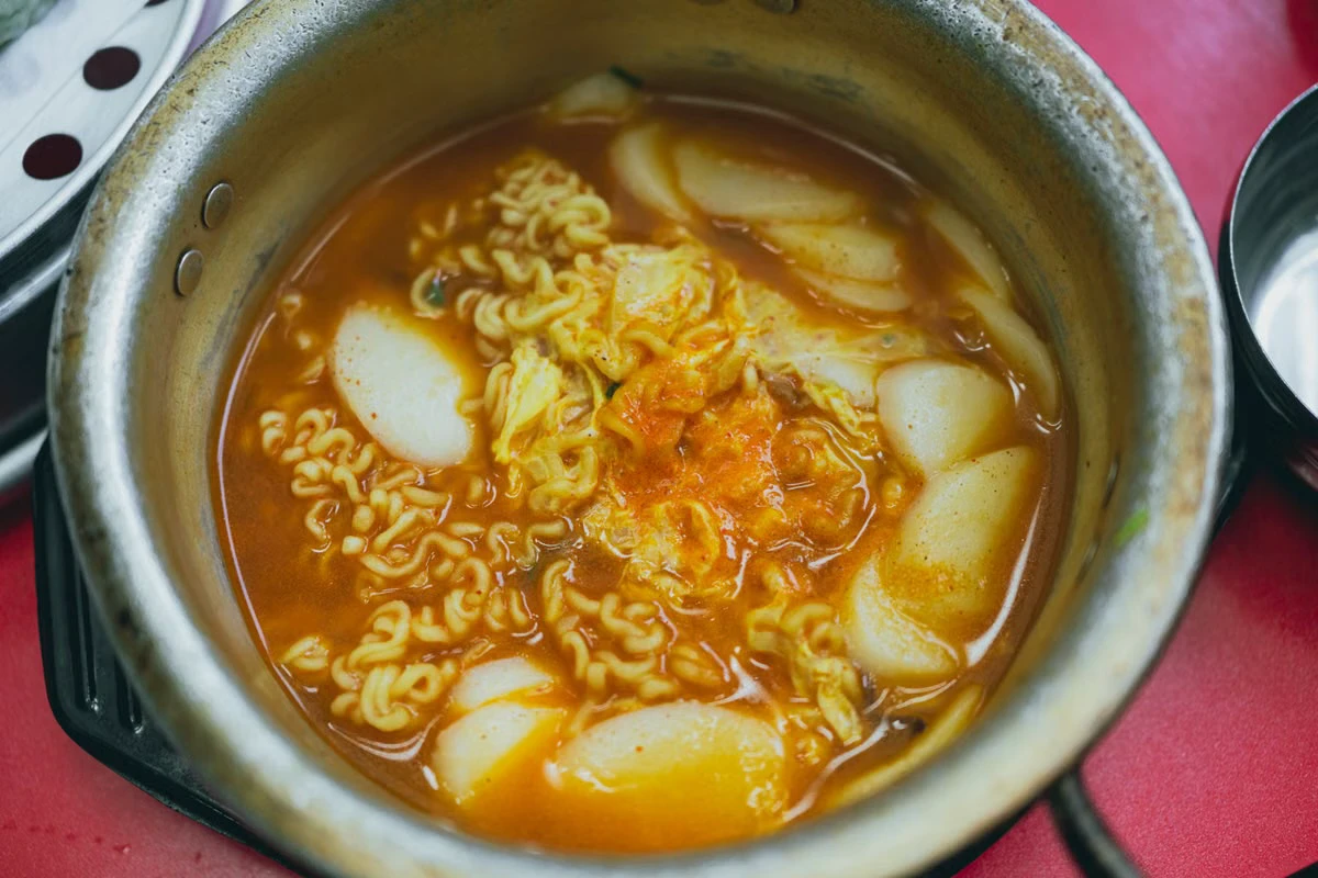 Korean tteokbokki and ramyeon simmered together in a spicy broth