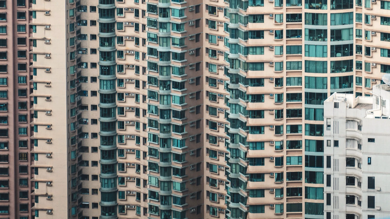 Close-up pattern of high-density residential apartment windows in Hong Kong