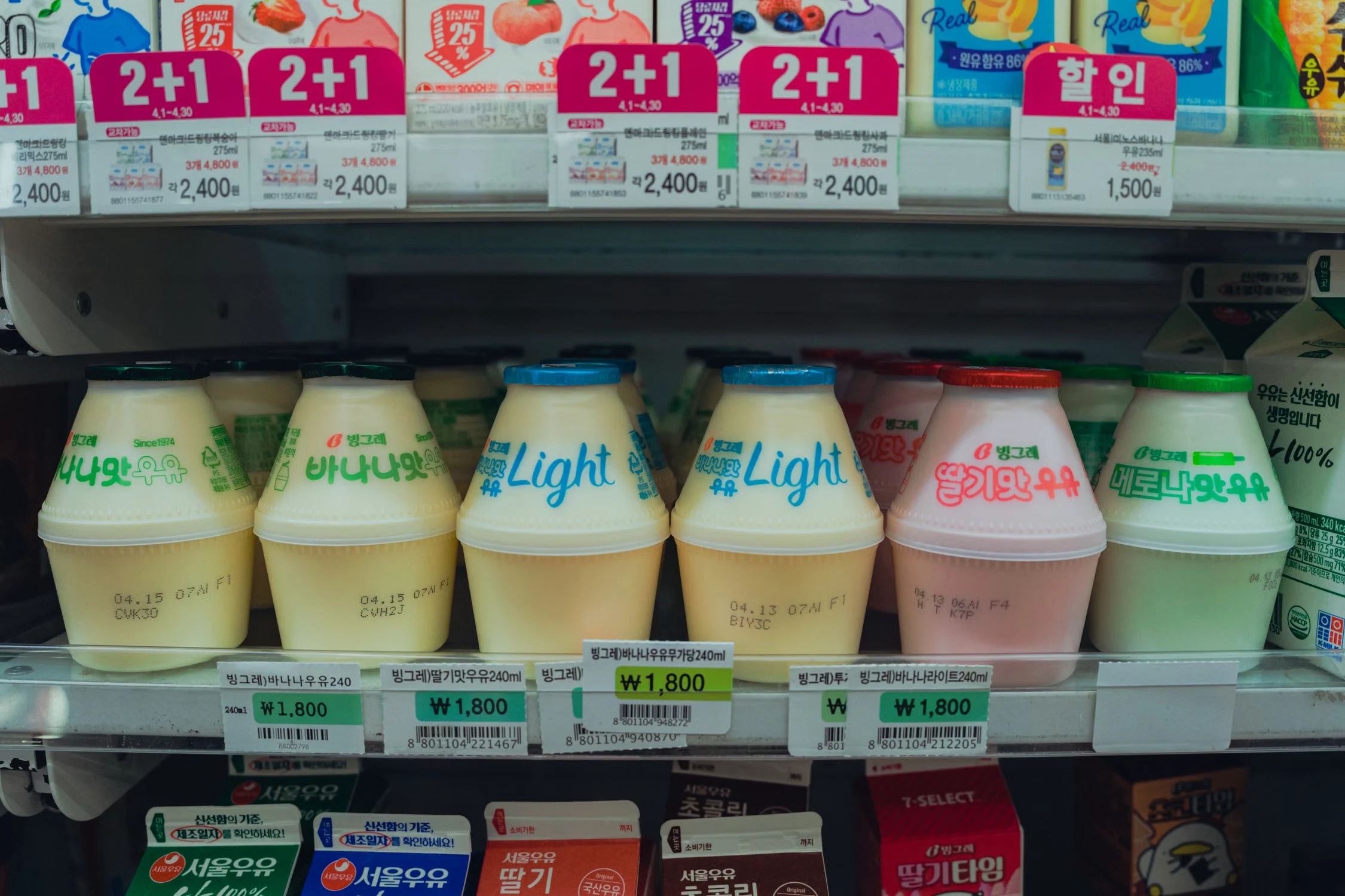 Korean flavored milk and drinks arranged in a Seoul convenience-store refrigerator