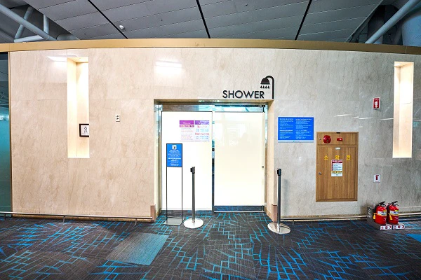 Full entrance to an Incheon Airport passenger shower room in the airside transfer lounge