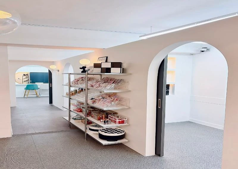 Bright personal color and makeup studio in Seoul with product shelves and consultation rooms