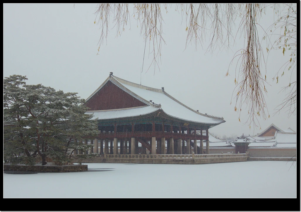 Gyeonghoeru Pavilion and its frozen pond covered in snow at Gyeongbokgung Palace