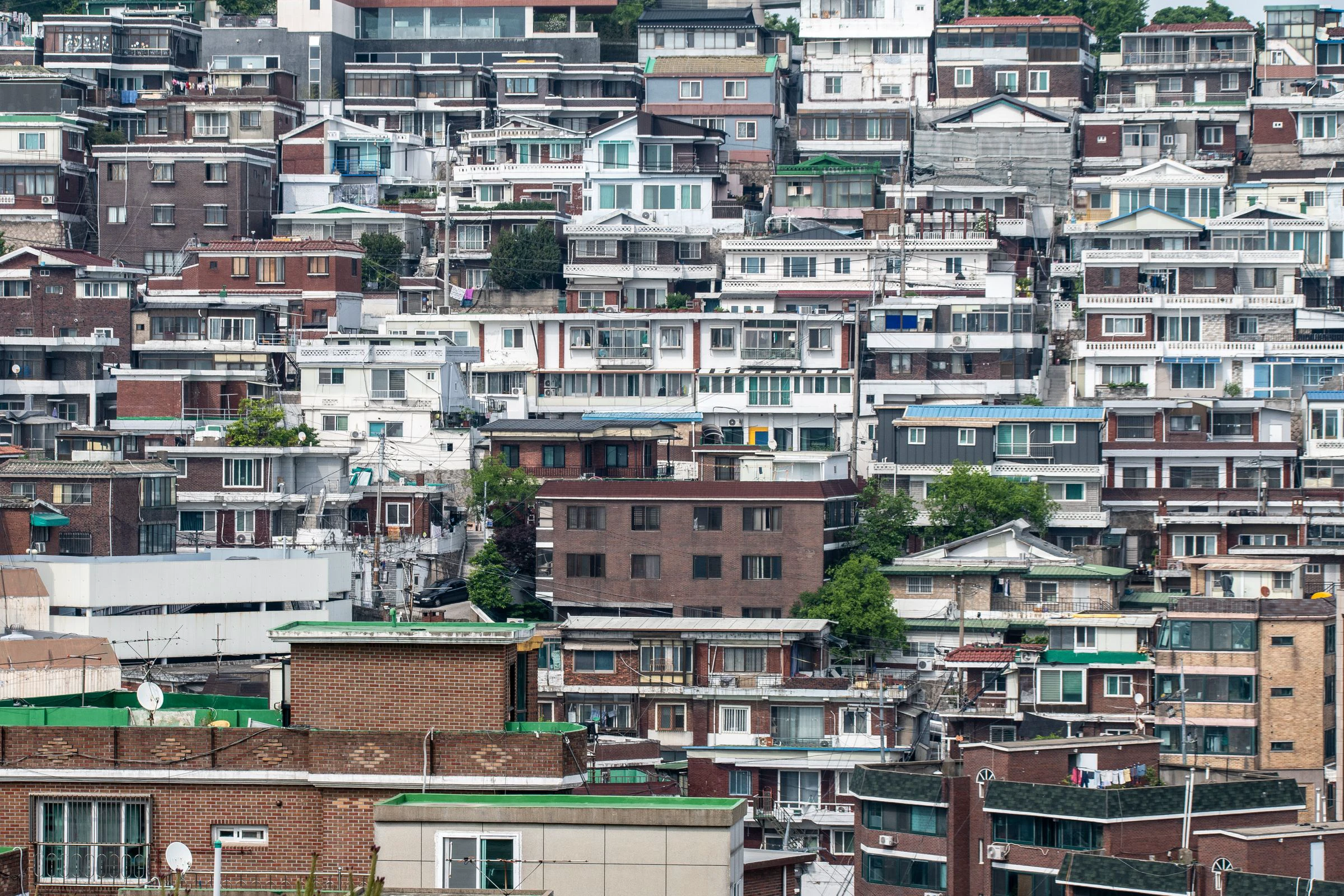 Dense hillside neighborhood of low-rise homes in Seoul