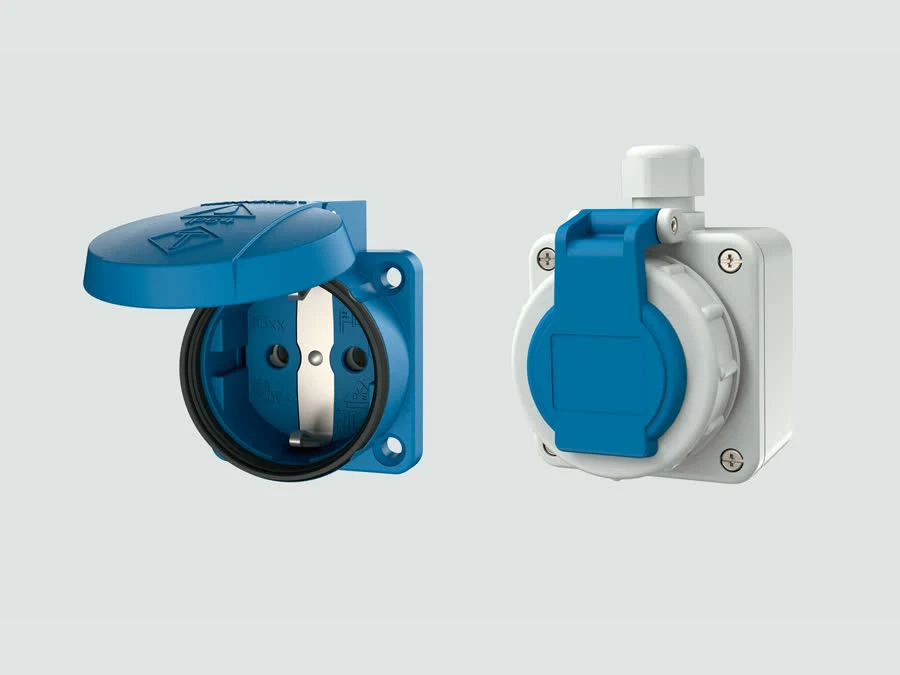 Industrial SCHUKO Type F receptacle with the metal side grounding contacts clearly visible