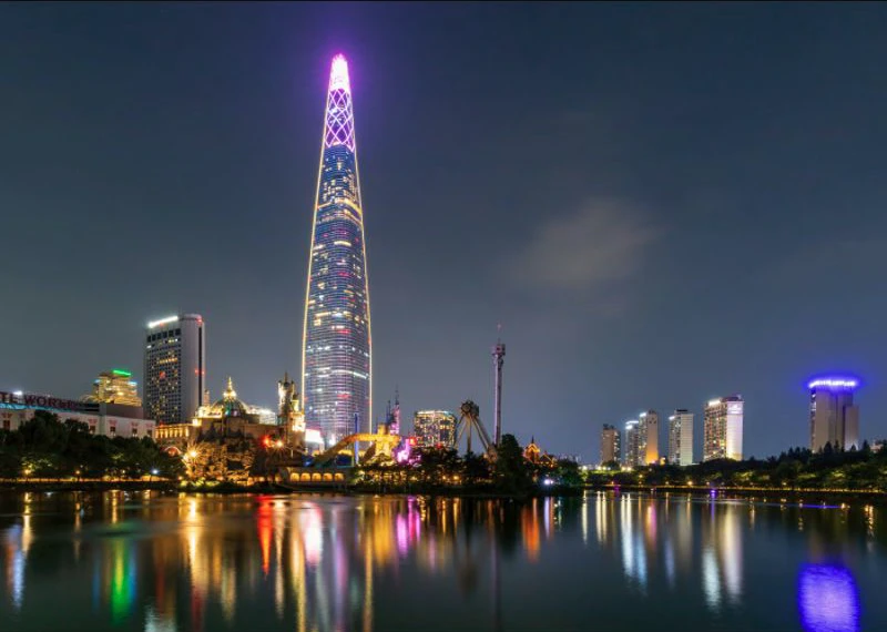 Seokchon Lake West Lake and Lotte World Tower illuminated at night