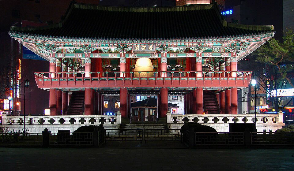 Illuminated Bosingak Pavilion seen across Jongno at night