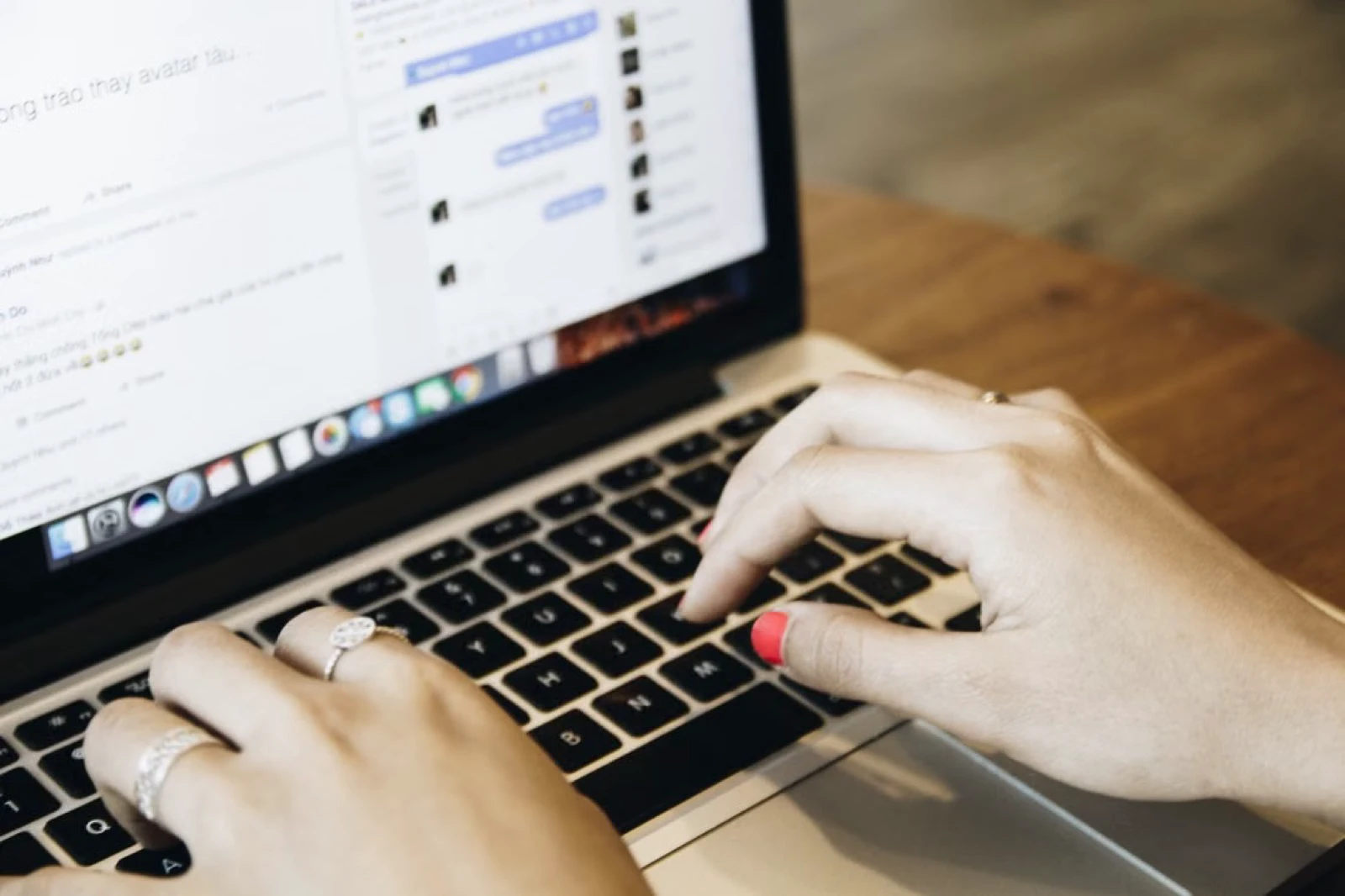 Hands typing on a laptop as an illustration of online community participation