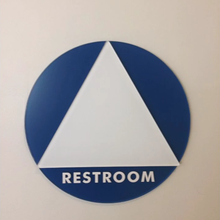 Abstract blue-and-white all-gender restroom sign at UC San Diego