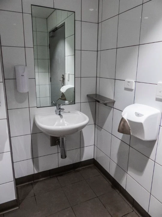 Accessible sink, mirror and changing surface at Roma Street Station in Brisbane